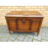 A linen chest with hinge top,