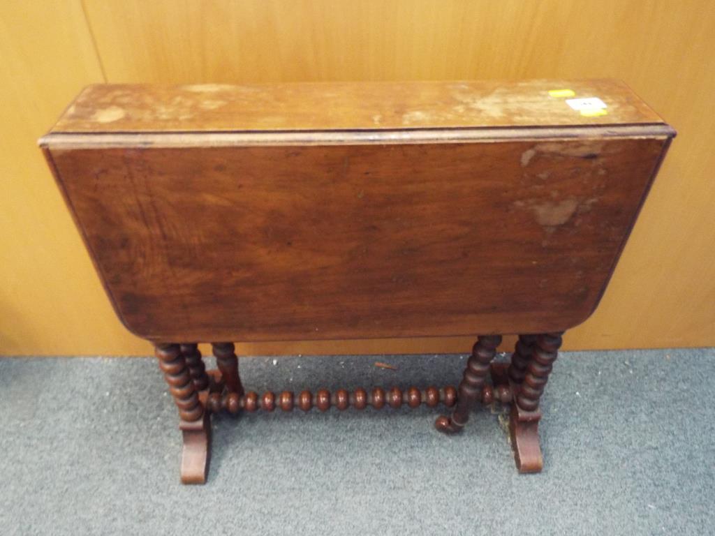 A mahogany drop-leaf table with barley twist supports 58 cm (h) x 68 cm (w) x 60 cm (d)