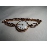 9ct gold - a 9ct gold lady's wristwatch with ceramic fascia, stamped 375, approx weight 19.