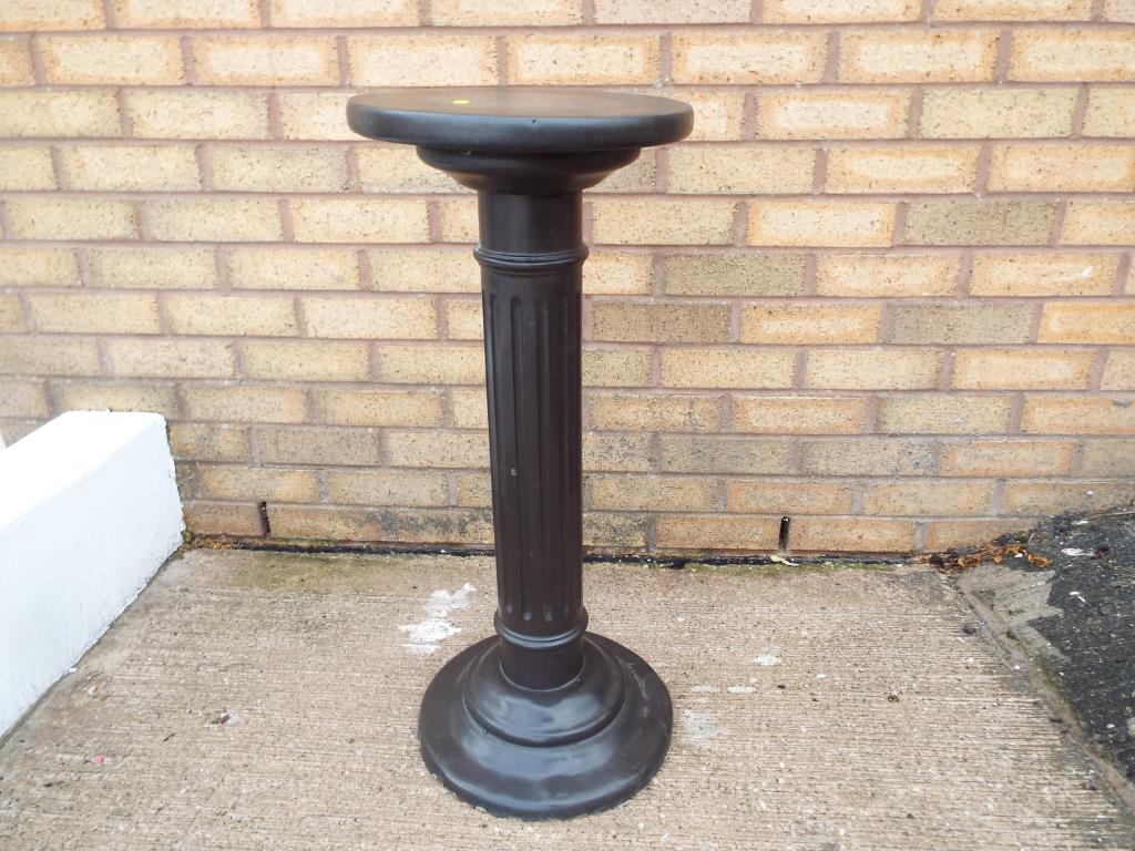 A good quality heavy plant stand in the form of a pillar,