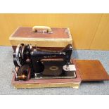 A Singer sewing machine with travel case