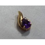 A lady’s 375 9ct gold amethyst and diamond pendant, approx. weight 0.9 grams. Est. £20 - £35.