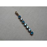 A lady’s hallmarked 9ct gold blue stone pendant drop, approx. weight 1.6 grams. Est £25 - £40.