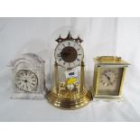 A glass domed mantle clock by Acctim,