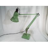 A desk top angle poise desk light,