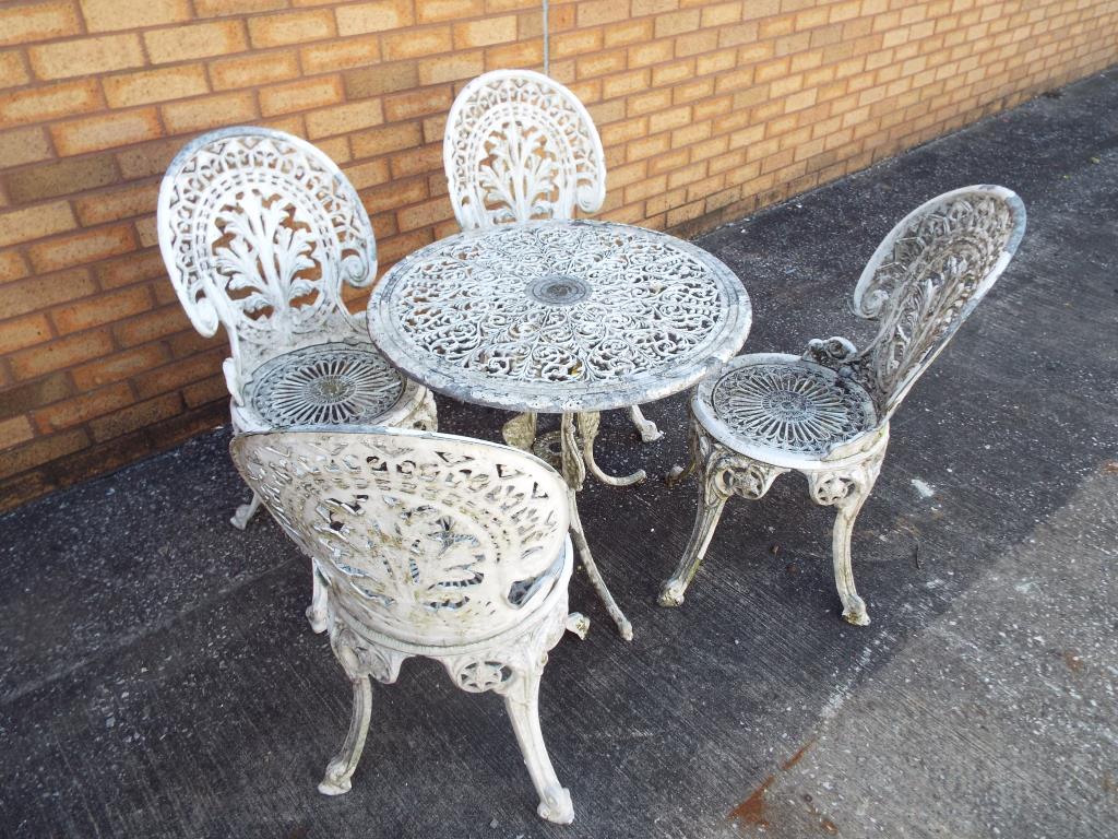A good aluminium garden set comprising circular table and four chairs - Est £80 - £120