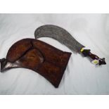 Zulu - a war hatchet with carved hardwood grip in wild boar skin sheath 55 cm (l) (in sheath).