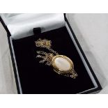 A 9 carat gold mother of pearl locket with 9 carat gold chain, chain length approx 44 cm,