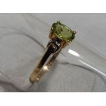 A lady's 9ct yellow gold oval shaped peridot ring approx weight 0.9 gm (all in) size K, boxed.
