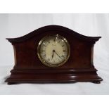 An early 20th century French mantel clock, the case of mahogany and walnut,