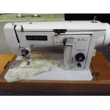 A Roy Aitken deluxe sewing machine with hard carry case,