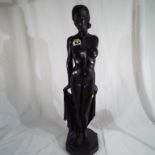 A heavy statue of a female nude, 225 RD 799228 and signed to the base,