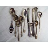 A collection of silver cutlery, predominantly hallmarked with some marked sterling,