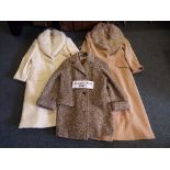 A collection of five lady's coats to include a full length beige lady's coat 70% wool,