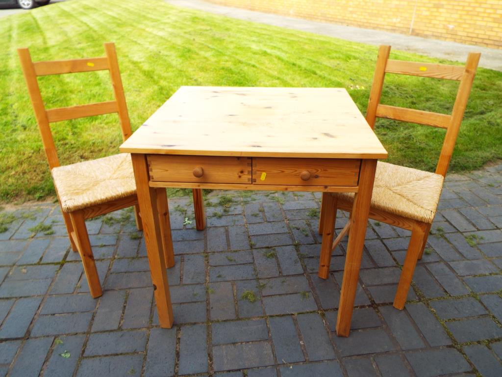 A good quality compact pine kitchen furniture set comprising a table,