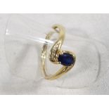 A lady's hallmarked 9 carat yellow gold ring set with sapphire and diamond, approx weight 1.