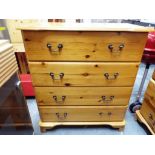 A pine chest of drawers,