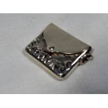 A white metal stamp holder in the style of an envelope, stamped .925, approx 2.2 cm x 2.