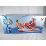 A Splash and Play child's motorised jet ski, unused and sealed in original box,