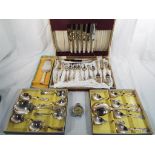 A canteen of plated cutlery and a quantity of plated flatware,