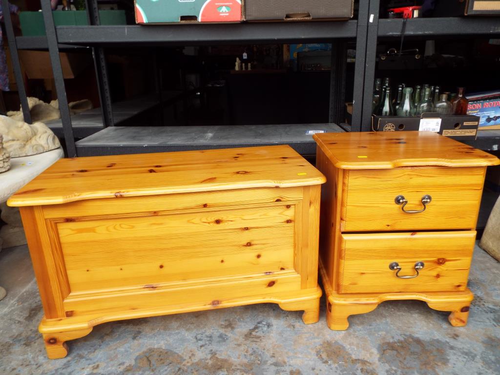 A pine linen chest, 50cm x 85cm x 43cm with matching bedside cabinet,