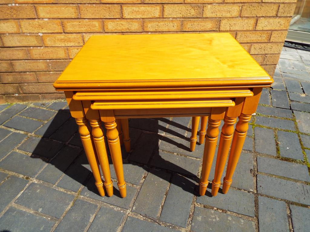 A modern maple nest of three tables from the Rossmore Collection,