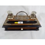 A desktop pen and ink stand with twin cut-glass inkwells and integral drawer