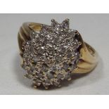 A lady's hallmarked 9 carat yellow gold diamond set cluster ring, approx diamond weight 0.