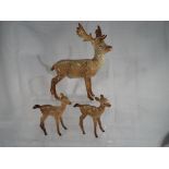 Beswick Pottery - a stag family comprising stag standing #981 and two fawns #1000B.