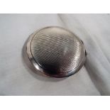 A sterling silver powder compact,