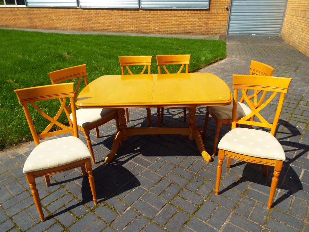 A good quality maple dining room table with six chairs by Rossmore,