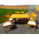 A good quality maple dining room table with six chairs by Rossmore,