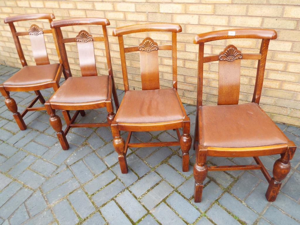 A set of four oak dining chairs with drop in seats (4)