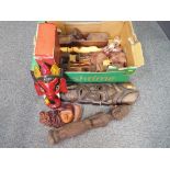 A mixed lot of wooden tribal carvings,