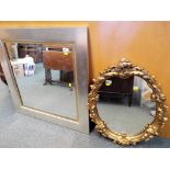 A modern good quality bevel edged wall mirror with silver coloured frame,