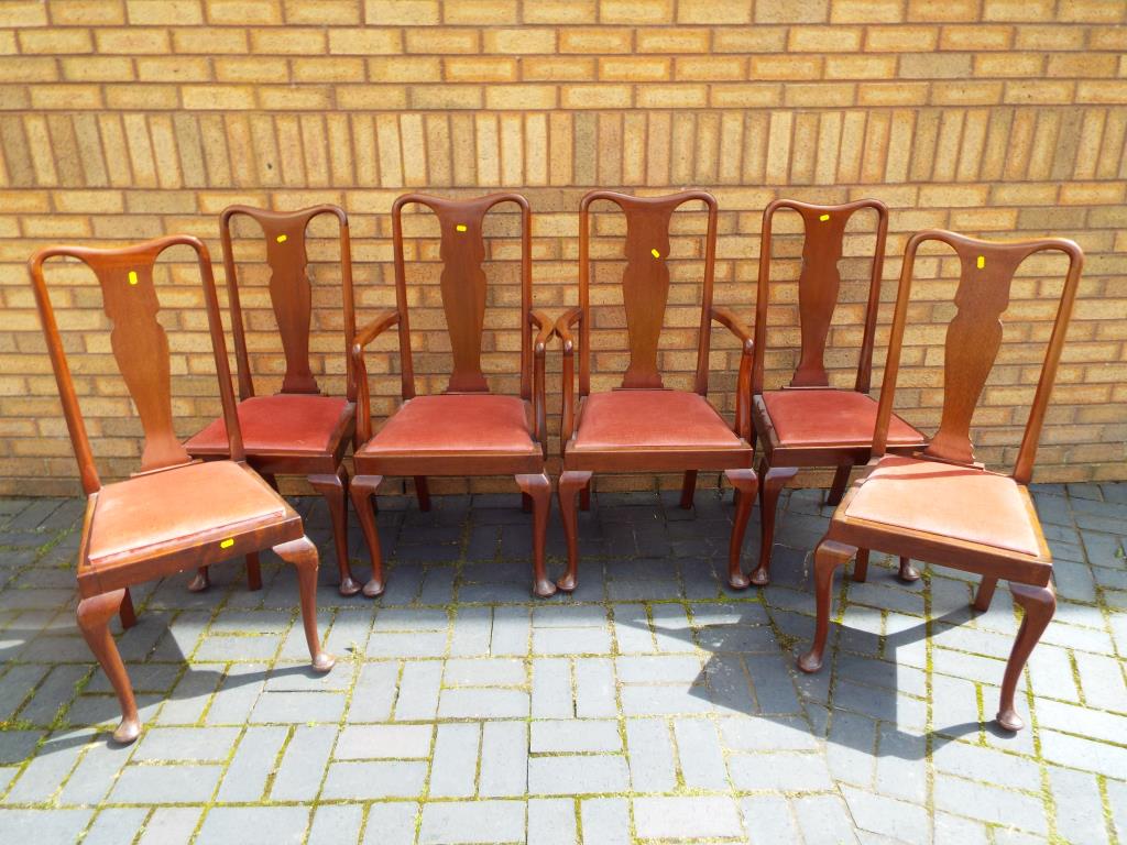 A set of two carvers and four dining chairs,