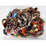 A good mixed lot of costume jewellery to include necklaces, bracelets,