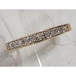 A lady's 9 carat gold half eternity ring set with 10 pt diamonds, size O, approx weight 1.