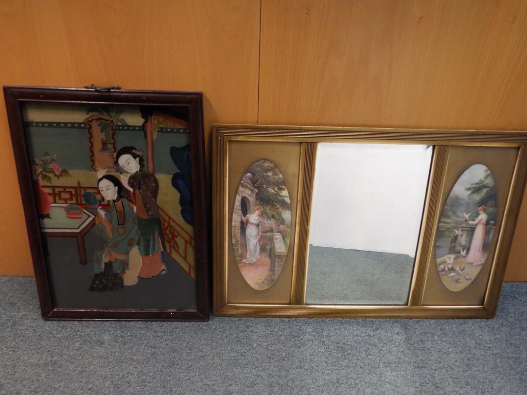 A bevelled mirror flanked by two oval images of female figures, mirror size 42 cm x 26.