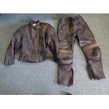 A black leather biker's jacket size 14,