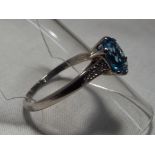 A lady’s hallmarked 9ct white gold topaz and diamond ring, approx. weight 2.1 gram, size S, boxed.