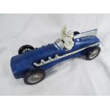 A cast iron model depicting a blue Hubley 1934 racing car driven by the Michelin Man,