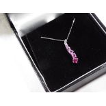 A 9 carat white gold pink sapphire drop pendant, approx weight 1.