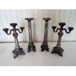 Two matched pairs of candlesticks,