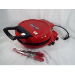 Unused retail stock (not returns) - a Flavor Chef by Flavorstone Pizza Cooker (red) with manuals