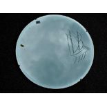 A circular bevel edged wall mirror with incised decoration in the style of a yacht,