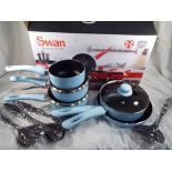 A Swan 9 piece non stick aluminium pan set decorated in a sky blue colour to include 16,