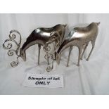 A collection of six metal figures depicting stags,