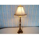 A good quality gilded metal and clear glass table lamp with shade,