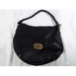 A good quality handbag marked Mulberry, Est 1971 on a brushed yellow metal plate,